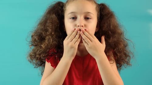 Girl Sending an Air Kiss to the Camera