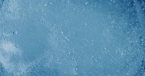 Oxygen Bubbles in Water on a Blue Abstract Background
