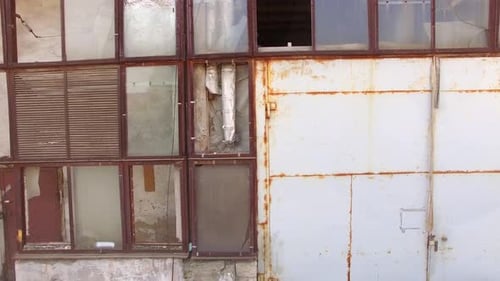 Glass Wall of a Building with Broken Windows