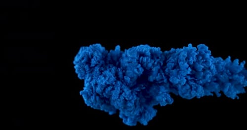 Blue Ink Spreading Underwater in Slow Motion
