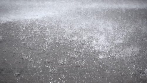 Torrential Rain Pouring on Urban Surface