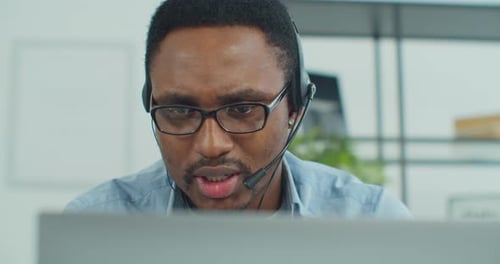Man Using Headset in Office Workplace