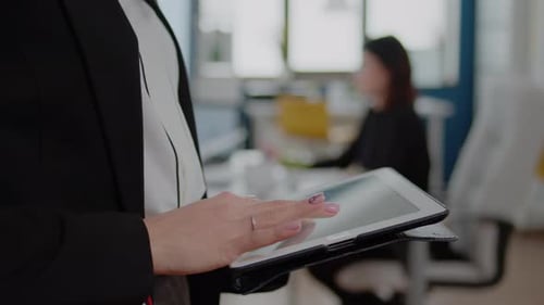 Close Up of Businesswoman Using Digital Tablet for Project