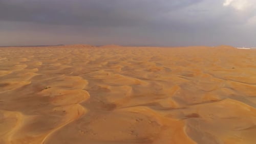 Aerial view of red Desert Safari with sand dune in Dubai City, United Arab Emirates or UAE
