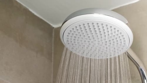 Shower in Hotel Bathroom. Dripping Drops