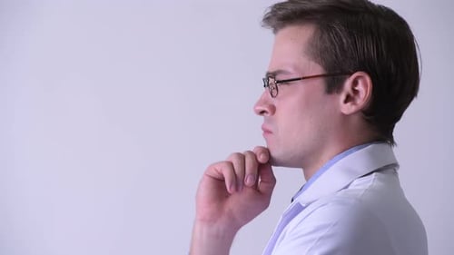 Profile View of Young Handsome Man Doctor Thinking