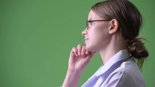 Profile View of Young Beautiful Woman Doctor Thinking