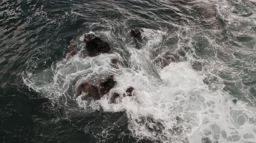 Ocean Waves Crashing on Rocks from Above