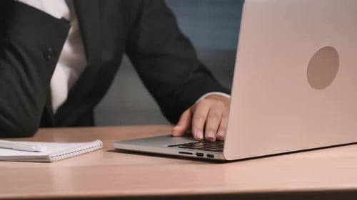 Woman Excited About Success on Laptop at Night