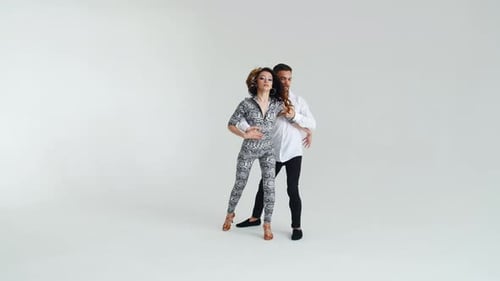 Concept of Love, Relationships and Social Dancing. Young Beautiful Couple Dancing Sensual Dance on a