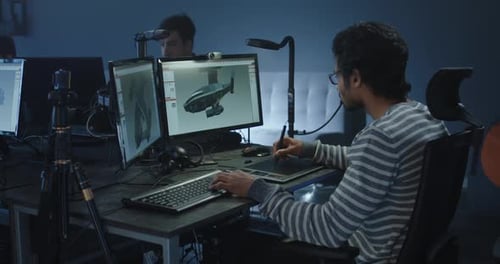 Designer Works on Vehicle Graphic on Computer
