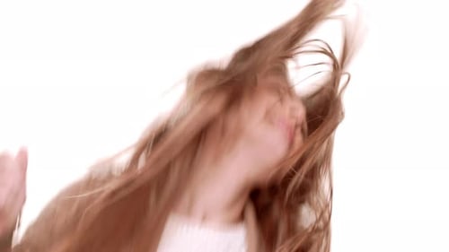 Smiling Woman Dancing and Singing Against White Background
