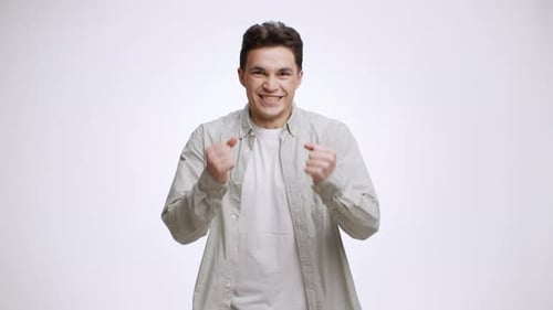 Man Celebrating Success with Fist Pump of Joy