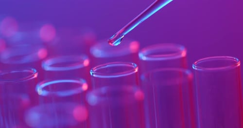 Pipette Adding Liquid into Glass Test Tubes