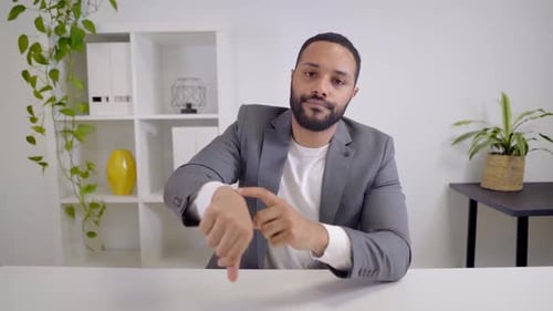 Webcam View of a Video Conference of an AfricanAmerican Businessman Looking at the Camera and