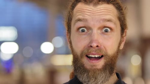 Man Expressing Surprise with Wide Eyed Astonishment