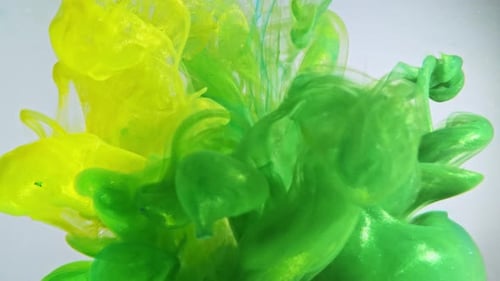 Colorful Nacreous Paint in Water Against White Background