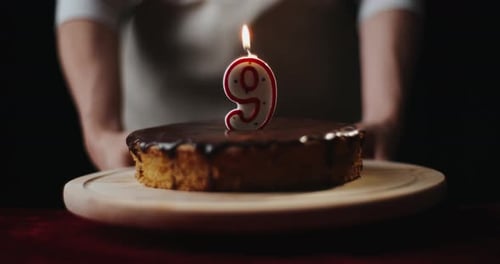 Chocolate Frosted Birthday Cake with Number Candle