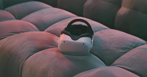 Close up of metaverse virtual reality goggles on a couch