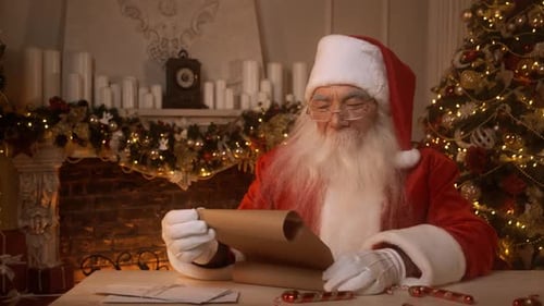 Santa Reads Christmas Letter in Cozy Home Interior
