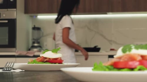 Poached Egg Meal Preparation in Modern Kitchen
