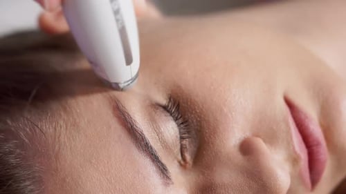 Woman Receiving Facial Treatment Close Up