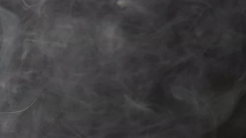 Drifting White Smoke on Black Background