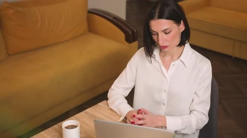 Tired Sad Businesswoman Face Looking at Laptop at the Home Office