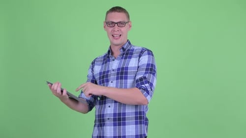 Man Demonstrating Digital Tablet with Green Screen Display