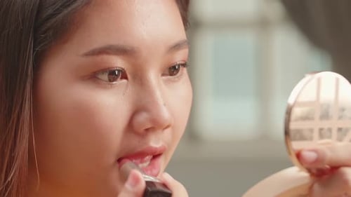 Closeup Of Asian Woman Face With Pink Matte Lipstick On Full Lips