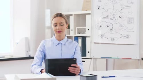 Businesswoman with Tablet Computer Works at Office 43