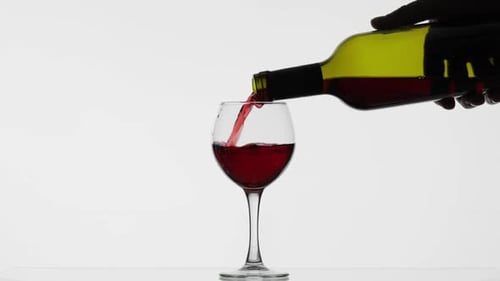Rose Wine. Red Wine Pour in Wine Glass Over White Background