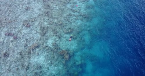 Beautiful boy and girl married on vacation have fun on beach on clean white sand background