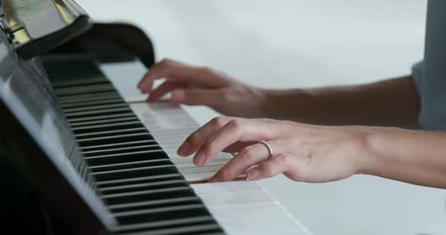 Hands Playing Piano Close-Up