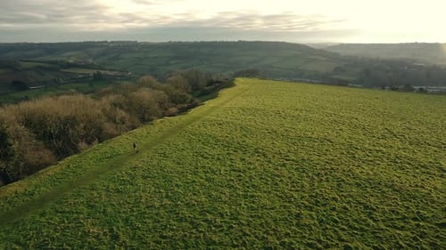 Dusk Dawn Aerial Drone Countryside Runner With Dog Sunrise Sunset Hilltop View 2
