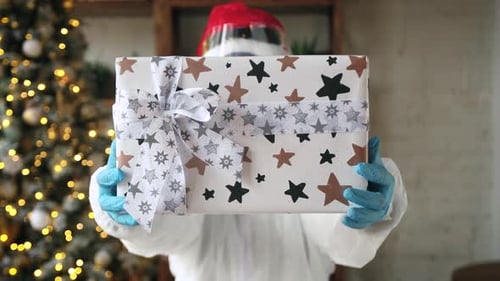 Festive Christmas Gift Delivery in Protective Suit