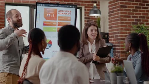 Team Reviewing Analytics in Office Conference Room