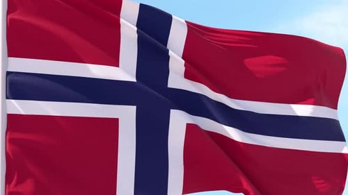 Norway Flag Waving Against Blue Sky