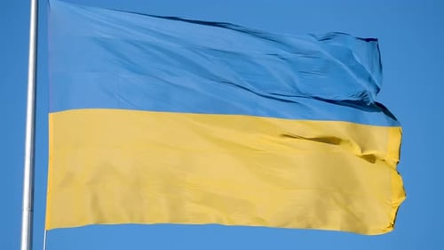 Ukrainian Flag Waving Against Clear Blue Sky