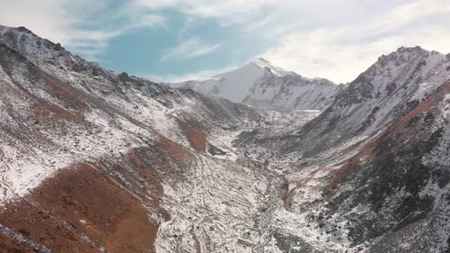 Snowy Mountain Range Aerial View in Winter