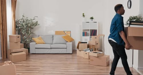 Young Couple Moving in Together with Cardboard Boxes