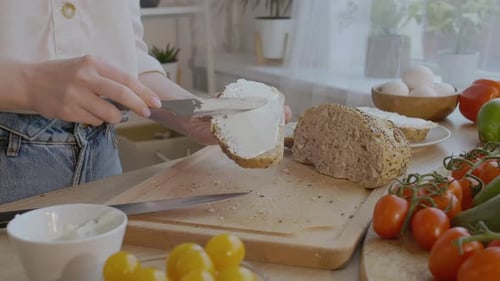 Woman Prepares Healthy Sandwich in Kitchen