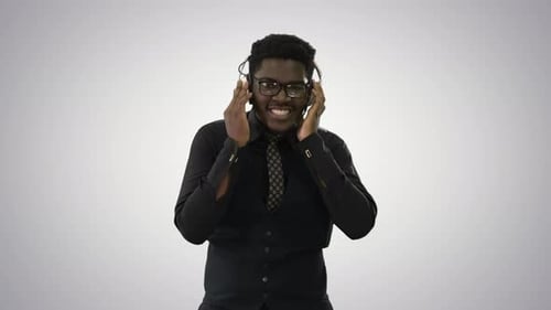 Smiling Man Listening Music with Headphones