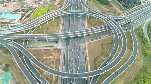 Top View To the Cars Driving on Multi-level Highway on the Sunset. Highway Multilevel Junction Road