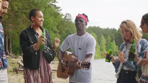 Young People Dancing On Beach