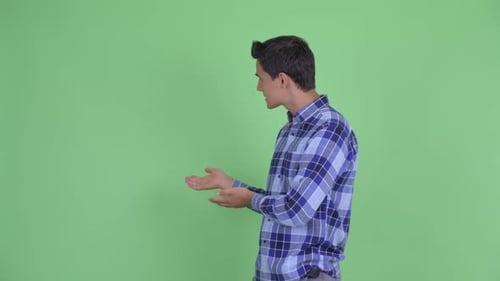 Happy Young Handsome Hipster Man Vlogging and Presenting Something