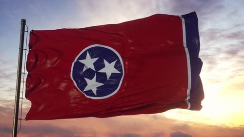 Waving Tennessee State Flag Against Sunset Sky