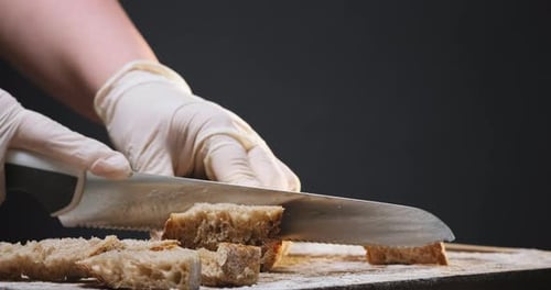 Slicing Bread on Cutting Board with Serrated Knife