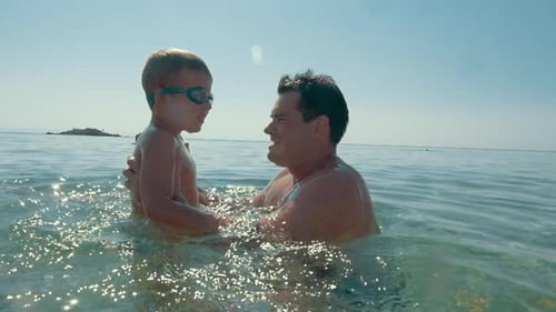 Enjoyable sea bathing with father