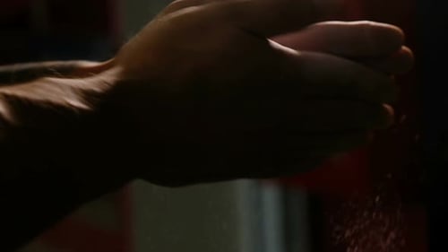 Close Up of Hands Spilling Colored Powder